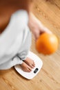 Healthy Food Eating. Woman On Weighing Scale. Weight Loss. Diet. Royalty Free Stock Photo