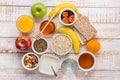 Healthy Food Fiber Source Breakfast Oatmeal Honey Fruits Apples Banana Orange Juice Water Green Tea Nuts. White Plank Wood Table Royalty Free Stock Photo