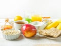 Healthy Food Fiber Sources Breakfast Oats Honey Fruits Apples Banana Orange Juice Water Green Tea Nuts. White Plank Wood Table Royalty Free Stock Photo