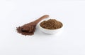 Healthy Food Flaxseeds on a Wooden Spoon and their Powder in a Bowl