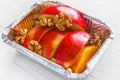 Healthy food in foil box, diet concept. Apple dessert Royalty Free Stock Photo