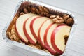 Healthy food in foil box, diet concept. Apple dessert Royalty Free Stock Photo