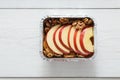 Healthy food in foil box, diet concept. Apple dessert Royalty Free Stock Photo