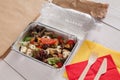 Healthy food in foil boxes, diet concept. Seafood salad Royalty Free Stock Photo