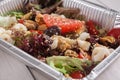 Healthy food in foil boxes, diet concept. Seafood salad mix Royalty Free Stock Photo