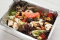 Healthy food in foil boxes, diet concept. Seafood salad mix Royalty Free Stock Photo