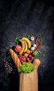 Healthy food in full paper bag of different products vegetables and fruits Royalty Free Stock Photo