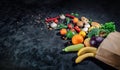 Healthy food in full paper bag of different products vegetables and fruits Royalty Free Stock Photo