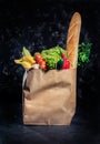 Healthy food in full paper bag of different products vegetables and fruits Royalty Free Stock Photo