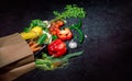 Healthy food in full paper bag of different products vegetables and fruits Royalty Free Stock Photo