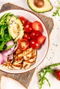 Healthy food. Greek salad with grilled Halloumi cheese, tomatoes, avocado, and arugula. Food recipe background. Close up.cuisine Royalty Free Stock Photo