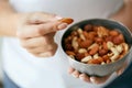 Healthy Food. Hands Holding Bowl With Nuts