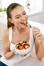 Healthy Food. Happy Woman Eating Salad With Fruits. Royalty Free Stock Photo