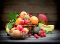 Healthy food, different organic fruits, fresh fruit in wicker basket Royalty Free Stock Photo