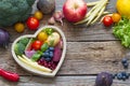 Healthy food in heart diet cooking concept with fresh fruits and vegetables