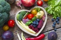 Healthy food in heart diet cooking concept with fresh fruits and vegetables Royalty Free Stock Photo