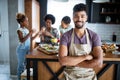 Happy family in the kitchen having fun and cooking together. Healthy food at home. Royalty Free Stock Photo