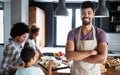 Happy family in the kitchen having fun and cooking together. Healthy food at home. Royalty Free Stock Photo