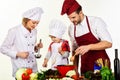 Healthy food at home. Happy family in kitchen preparing dinner. Son with parents cooking. Royalty Free Stock Photo