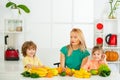 Healthy food at home. Portrait of cute family is making fruit juice. on white kitchen. Raw, vegan, vegetarian, alkaline Royalty Free Stock Photo