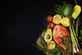 Healthy food for ketogenic diet concept on black background. Foods high in vitamins, minerals and antioxidants