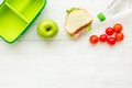 Healthy food in lunchbox for dinner at school white table background top view mockup Royalty Free Stock Photo