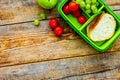 healthy food in lunchbox for dinner at school wooden table backg Royalty Free Stock Photo