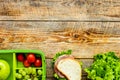 Healthy food in lunchbox for dinner at school wooden table backg Royalty Free Stock Photo