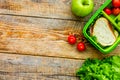 healthy food in lunchbox for dinner at school wooden table backg Royalty Free Stock Photo