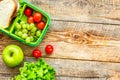 healthy food in lunchbox for dinner at school wooden table backg Royalty Free Stock Photo