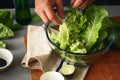 Healthy food man cooking green detox salad romaine lettuce