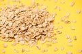 Healthy food. Muesli for breakfast. Yellow bright background. Many flakes