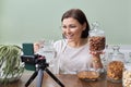 Nutritionist talks about benefits of soaking nuts in water, recording video blog vlog