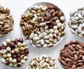 Healthy food. Nuts mix assortment on white grey table top view. Collection of different legumes for background image close up nuts Royalty Free Stock Photo