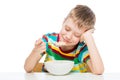 healthy food - oatmeal for breakfast, a boy with a plate on a white Royalty Free Stock Photo