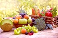 Healthy food, organic fruit and vegetable in wicker basket on rustic wooden table Royalty Free Stock Photo