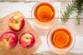 Healthy food: red apples and rosemary on wooden table Royalty Free Stock Photo