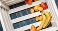 Healthy food: Ripe fresh Bananas, pears, apricots on the bottom of a wooden box. Royalty Free Stock Photo