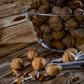 Healthy food: Round nuts with walnuts lie on a wooden table