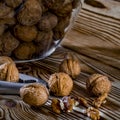 Healthy food: Round nuts with walnuts lie on a wooden table