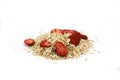 Healthy food. Rye oat flakes with dried strawberries isolated on white background. Royalty Free Stock Photo