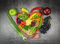 Healthy food selection clean eating for heart life cholesterol diet health concept. Fresh salad fruit and green vegetables mixed Royalty Free Stock Photo
