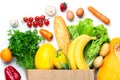 Healthy food in shopping bag. Vegetables and fruits assortment isolated on white background. Vegetarian healthy food concept Royalty Free Stock Photo