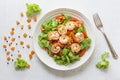 Healthy food shrimp salad lettuce carrot tomato in bowl on wood background Royalty Free Stock Photo