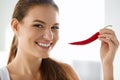 Healthy Food. Smiling Woman Holding Red Chili Pepper. Lifestyle Royalty Free Stock Photo