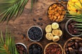 Healthy food snack: sun dried organic mix of dried fruits: apricots, figs, raisins, dates, and other on wooden table, top view Royalty Free Stock Photo