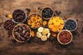 Healthy food snack: sun dried organic mix of dried fruits: apricots, figs, raisins, dates, and other on wooden table, top view Royalty Free Stock Photo