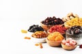 Healthy food snacks: natural dried fruits mix in bowls on white background Royalty Free Stock Photo