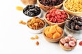 Healthy food snacks: natural dried fruits mix in bowls on white background Royalty Free Stock Photo