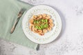 Healthy food stir fried shrimp asparagus in plate on white slate table